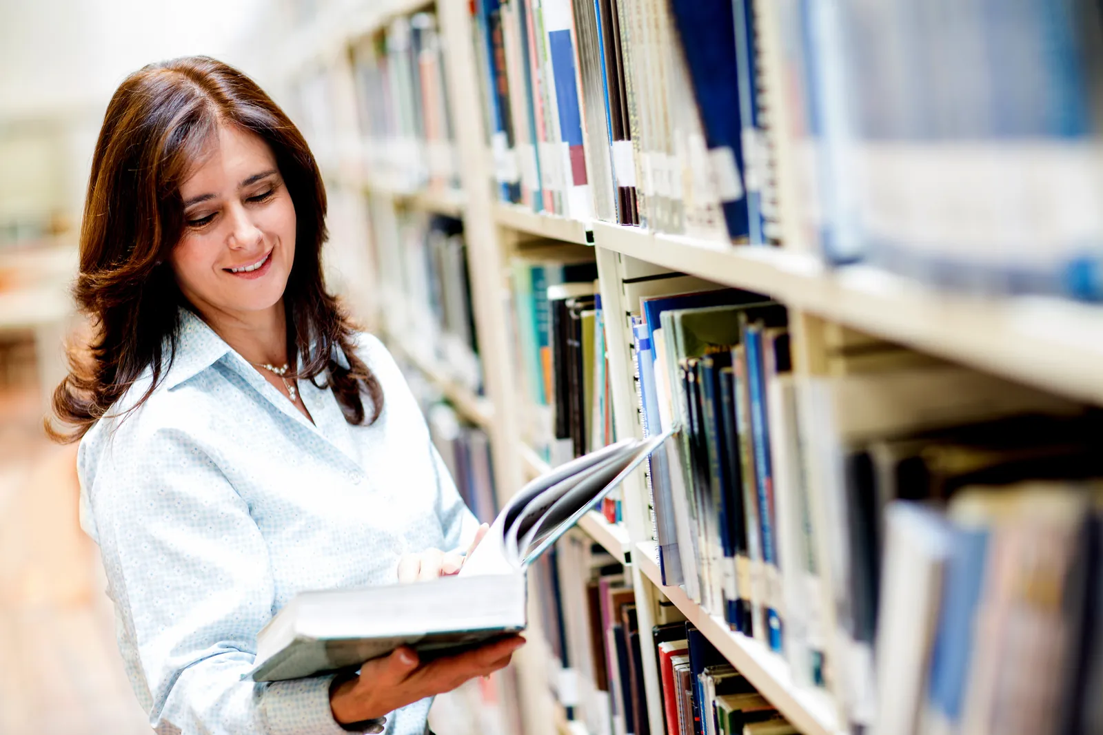 A researcher reading in a university library