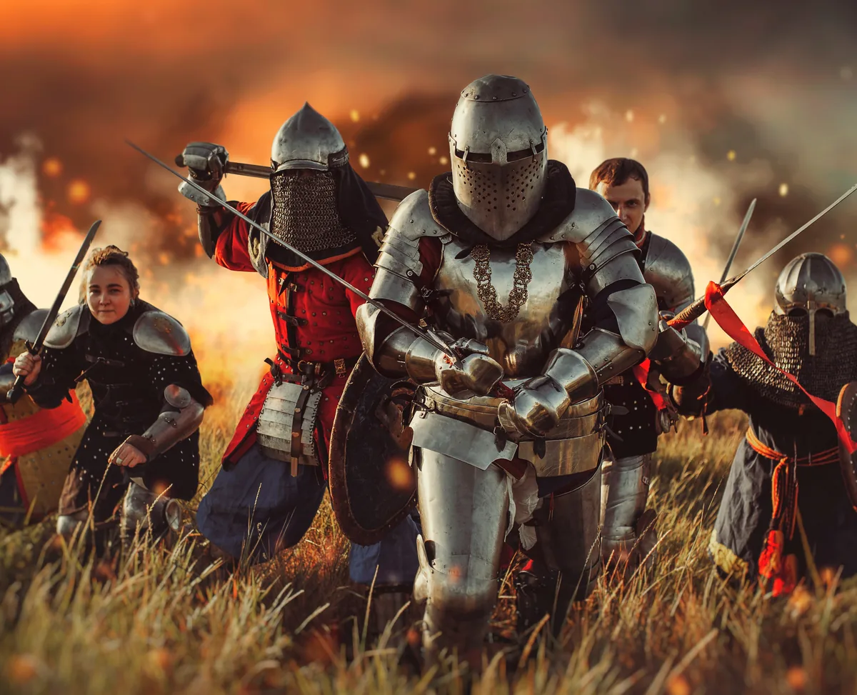 Armoured figures advancing through a burning field: the kind of production a story world ends up as